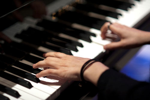 TeganPiano Tegan Quin playing piano in the studio March 2012 - Photo by Lindsey Byrnes